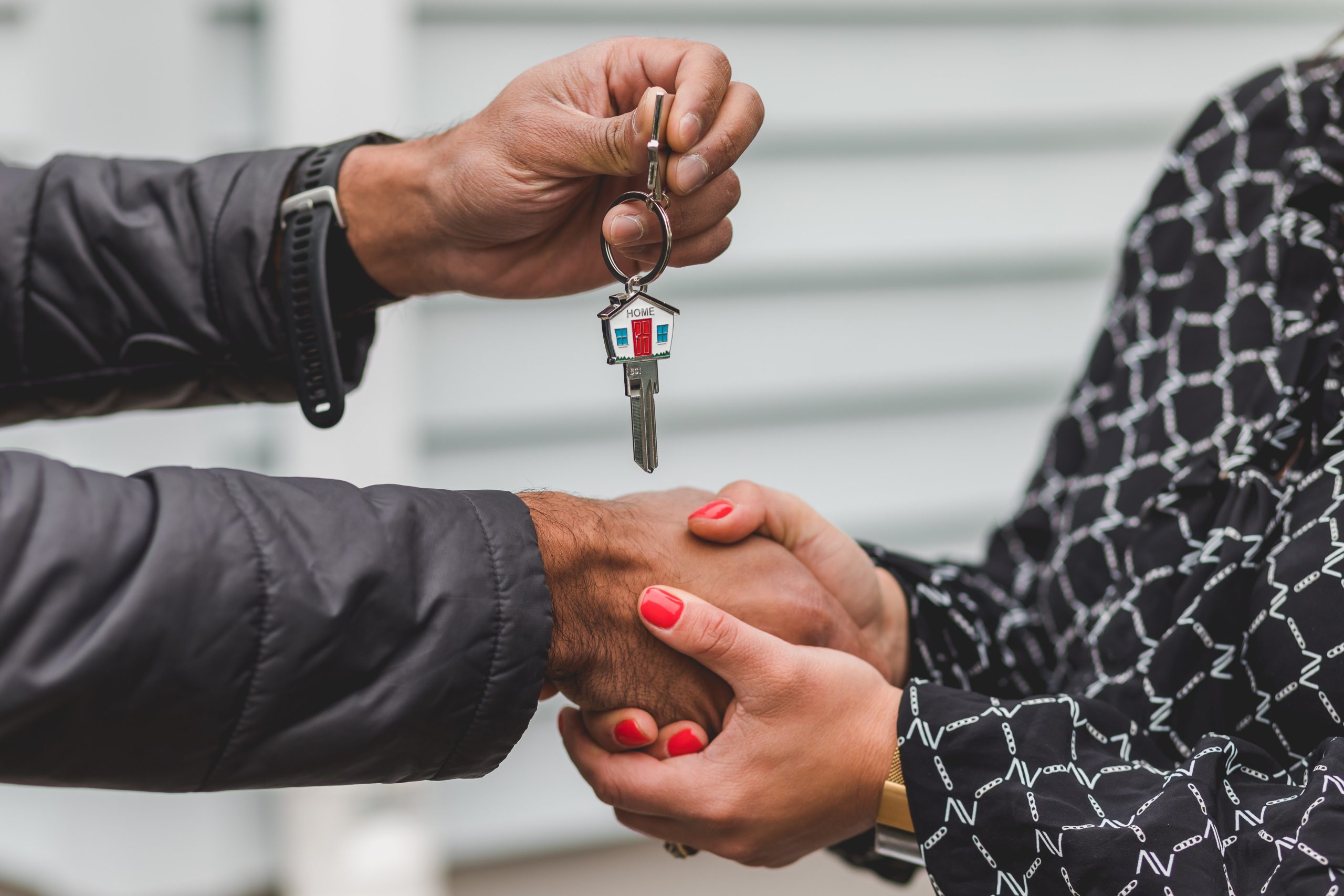Real Estate Agent giving house keys